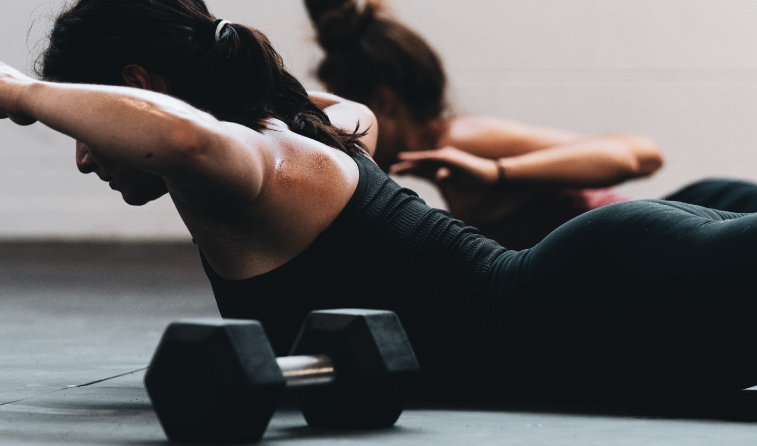 Close-up shot of women exercising. Guests receive complimentary gym passes at The Ridge Athletic Club a partner of our downtown Bozeman hotel